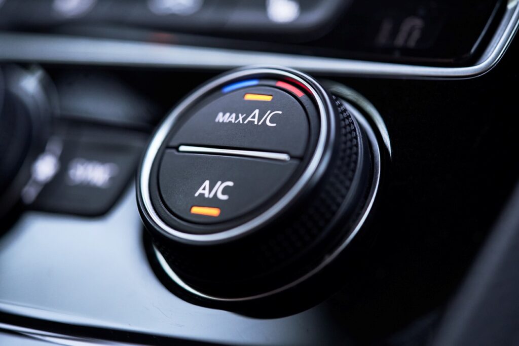 A car’s AC control is set to maximum cooling.